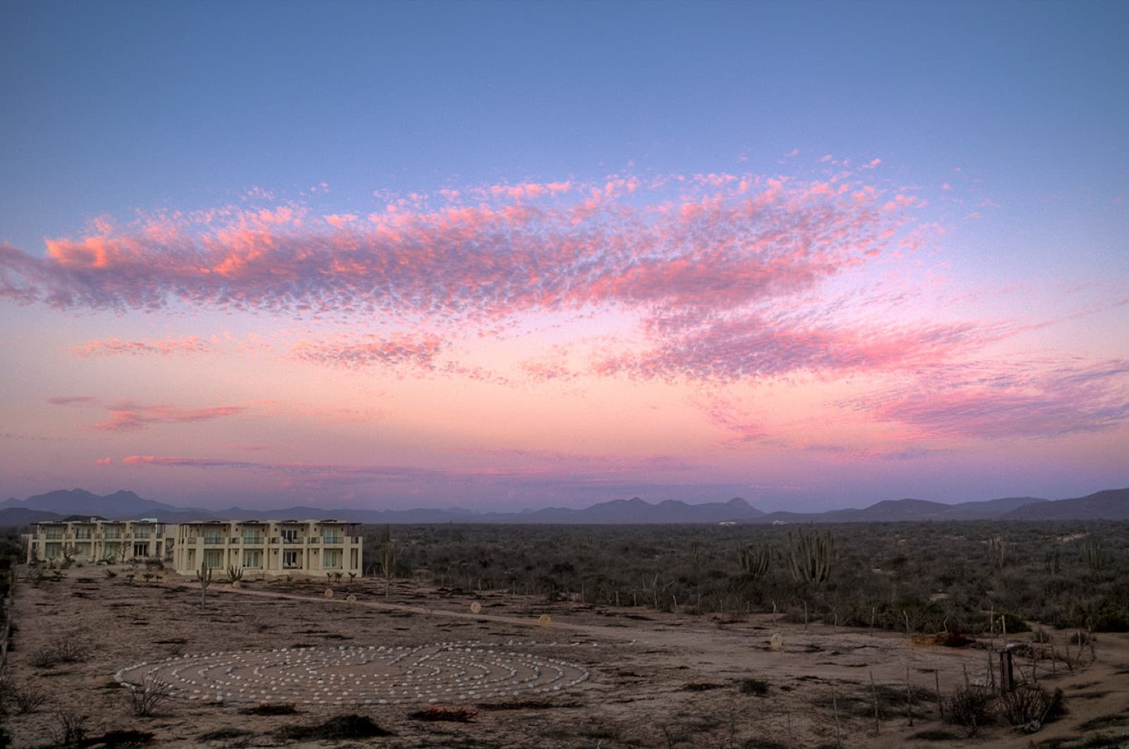 Sunset over the labyrinth and guest rooms